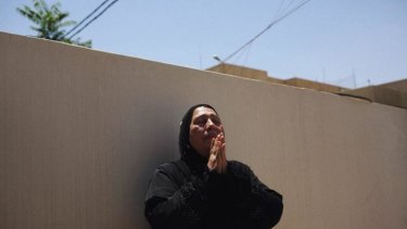 Kasra Hussein Hassan, 52, mourns her son who was killed on Saturday when the Iraqi government bombarded Tikrit.