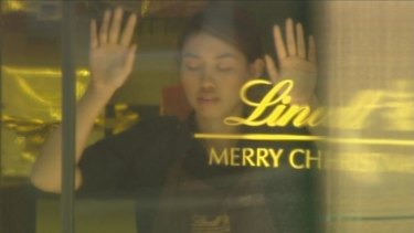 Seven had the footage advantage ... Elly Chen being held hostage inside the Lindt cafe.