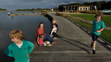 Surf Coast mothers Clare Eddy (left) and Suellen Eskrigge with their children on the Anglesea riverfront.