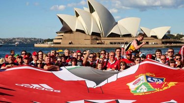 The giant Lions shirt is held by  fans in Sydney on Friday.