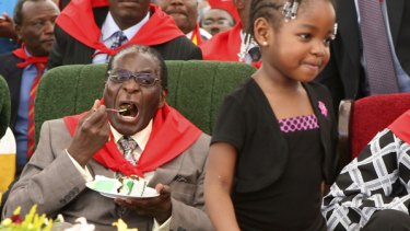It's my party: Robert Mugabe has his cake, but Save the Children warns that one in 10 Zimbabwean children will die before they reach five. 