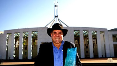 Mick Dodson with his award outside Parliament House.
