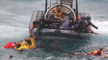 Lost at sea: A photo from the Coroner's report shows asylum seekers being rescued off Christmas Island in December 2010.