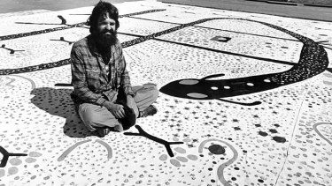 An "urban Indigenous" artist: Trevor Nickolls in 1979, with one of his works for the show <i>Operation Aborigine.</i>