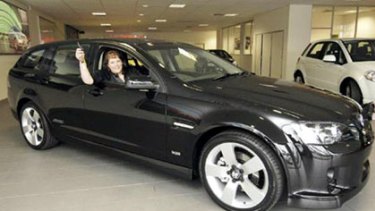 Sonya Causer sits proudly in the Holden SportWagon she successfully bid for in the Royal Children's Hospital Good Friday Appeal Online Auction last year.