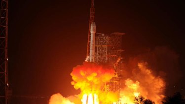 The Chang'e-3 rocket carrying the Jade Rabbit rover blasts off, from the Xichang Satellite Launch Center in the southwest province of Sichuan.