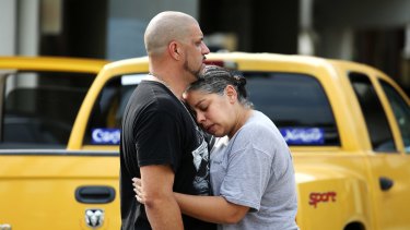 Ray Rivera, a DJ at Pulse nightclub, is consoled by a friend after the shooting.