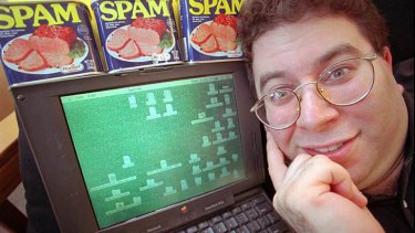 Sanford Wallace, president of Cyber Promotions, poses with his computer and cans of Spam processed meat in Dresher, Pennsylvania, in this May 8, 1997 file photo.