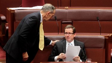 Greens leader Senator Bob Brown comforts an emotional Steve Fielding after Senator Fielding delivered his valedictory speech to the Senate yesterday.
