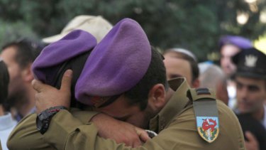 Comrades of Hadar Goldin mourn during his funeral on August 3.