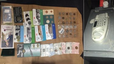 Some of the suspected stolen coin collection and a safe recovered by police. 