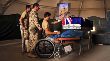 Wounded soldiers say their goodbyes at a remembrance service for comrades Tomas Dale and Grant Kirby, who were killed in Afghanistan last week.