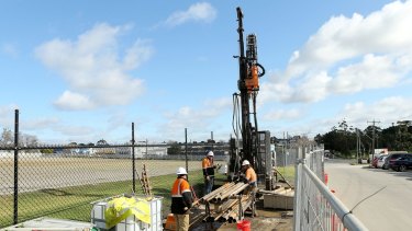 Transurban site investigators are seen drilling on the proposed Western Distributor toll road in Yarraville.