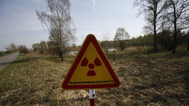 A radiation warning sign inside the exclusion zone.