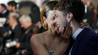 Director Xavier Dolan, Jury Prize award winner for his film 'Mommy', and actress Suzanne Clement pose on the red carpet.