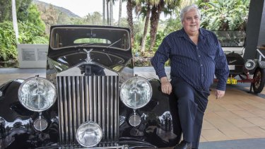 Who wants to be a billionaire? … Clive Palmer at the Palmer Coolum Resort with a car from his vast car collection.