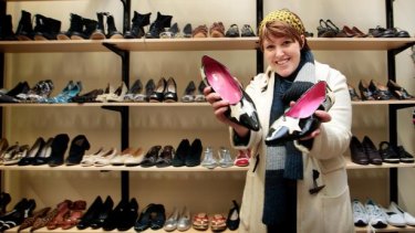 Stephanie Barr scours the shoe rack for vintage bargains at the reopened Salvos store on Bourke Street.