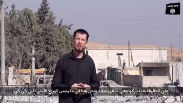 Propaganda footage: A video released by the Islamic State (IS) group purportedly shows 43-year-old kidnapped British reporter John Cantlie standing in the war-damaged town of Kobane. 