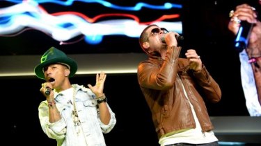 Pharrell Williams and Robin Thicke perform at the 2014 Walmart shareholders meeting.