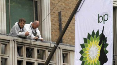 Greenpeace protesters on a balcony at the BP headquarters in central London.