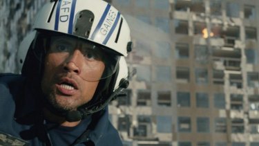 Dwayne Johnson in a helicopter scene from <i>San Andreas</i>.  