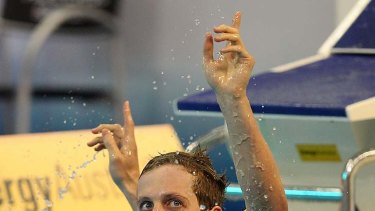 Nick D'Arcy celebrates his win in the 200 butterfly last night.