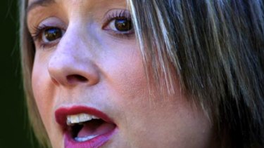 Often observed applying lip gloss during question time...Kristina Keneally fronts the media yesterday.