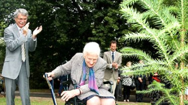 Stolen ... Dame Elisabeth Murdoch plants her birthday as Royal Botanic Gardens director Dr Philip Moors looks on.