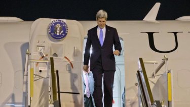 US Secretary of State John Kerry arrives in Kuwait City on January 14, 2014 to attend a Syria donor's conference.    