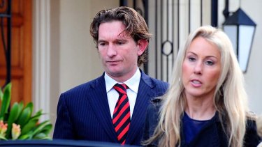 Essendon coach James Hird and his wife Tania leave their Toorak home on Tuesday morning.