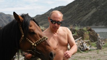 Putin in Siberia with a horse in 2009.
