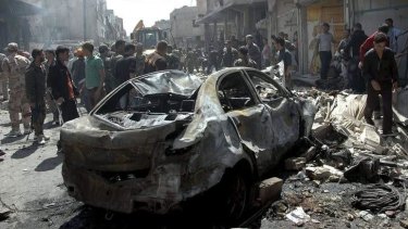The latest car bomb that has killed at least 19 people, followed earlier attacks as pictured in this handout released from Syria's national news agency.