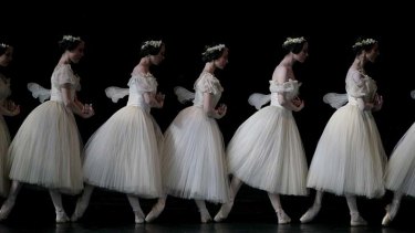 In step ... the Paris Opera Ballet in a scene from <i>Giselle</i>.