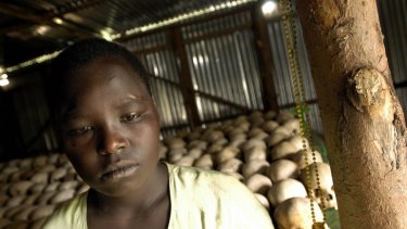 Uwyisenga Ester, 18, pictured here in 2004, was a survivor of one of the worst killing fields in Rwanda's 1994 genocide. Women and children make up the majority of civilians killed in armed conflict.