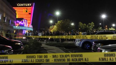 People gather outside the Century 16 movie theatre in Aurora, Colorado following the mass shooting.
