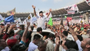 Indonesian presidential candidate Prabowo Subianto greets his supporters during a rally at Gelora Bung Karno Stadium in Jakarta on Sunday. 