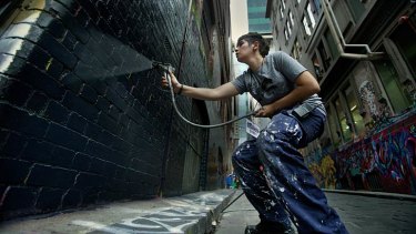 Hosier Lane is given a fresh undercoat to provide a clean slate for 100 artists who will transform it over six days as part of the <i>Melbourne Now</i> project ALLYOURWALLS.