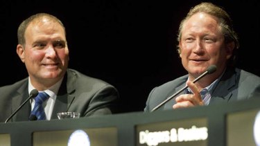 Andrew Forrest (right), flanked by Fortescue chief executive Neville Power, speaks at the conference yesterday.