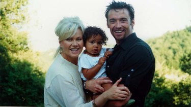 Deborra-Lee Furness, pictued with partner Hugh Jackman and son Oscar, has been a vocal advocate for changes to Australian adoption laws.