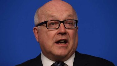 Attorney-General Senator George Brandis has cancelled an appearance at a free speech symposium.