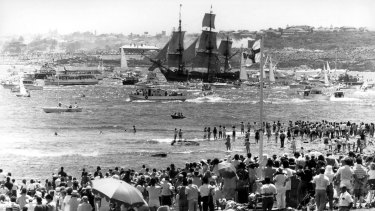 Gathering: The re-enactment flotilla makes its way into Sydney harbour.