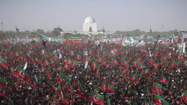 A sea of people waving the flag of Imran Khan's Movement for Justice Party turn out in Karachi.