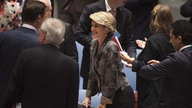 Centre of attention: Julie Bishop talks to other attendees before a Security Council meeting on small arms at UN headquarters in New York.