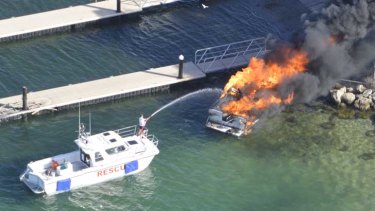 Firefighters estimate the Woodman Point fire caused $100,000 damage to the boat and jetty.