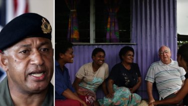 Powerful man... Frank Bainimarama, left, and father Kevin Barr sits with friends in the Muanivatu squatter settlement in Suva... he says Bainimarama is "unique... and anything but mad".