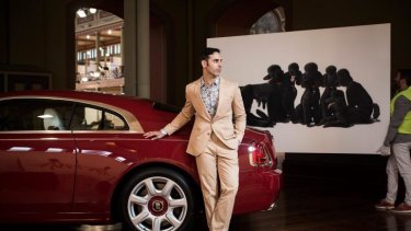 Artist Michael Zavros with his work <i>A Rolls-Royce</i> at the Melbourne Art Fair.