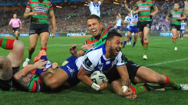 Top Dogs &#8230; Krisnan Inu crashes over for Canterbury's first try against South Sydney on Saturday night. Bulldogs coach Des Hasler has created an attacking style of football that has taken the game to a new level.