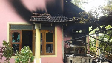 A house stands vandalized in racial violence. Sri Lankan police said Saturday that more than a dozen people were arrested following racial violence in the country's south that started over a dispute between majority Buddhists and minority Muslims. 