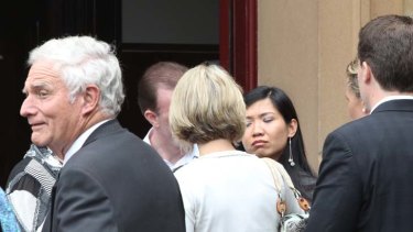 Trial opens &#8230; Richard Carruthers's father, Douglas Carruthers, left, and the victim's wife, Phuong Nguyen, outside court.