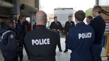 Officer in charge of the Police Dive Squad Sergeant Rod Veal and squad diver Brody Baker  prepare the team for their trip to Karratha.